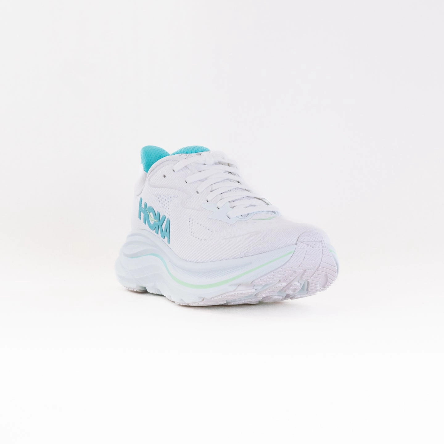 Hoka Clifton 10 (Women's) - White/Cielo Blue running in a train station area shoes