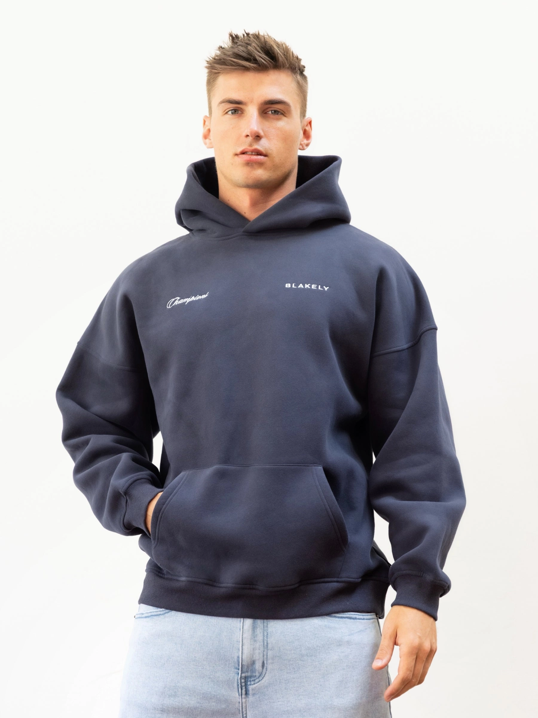 Champions Legacy Relaxed Hoodie - True Navy Trendy Look Versatile Layering Piece