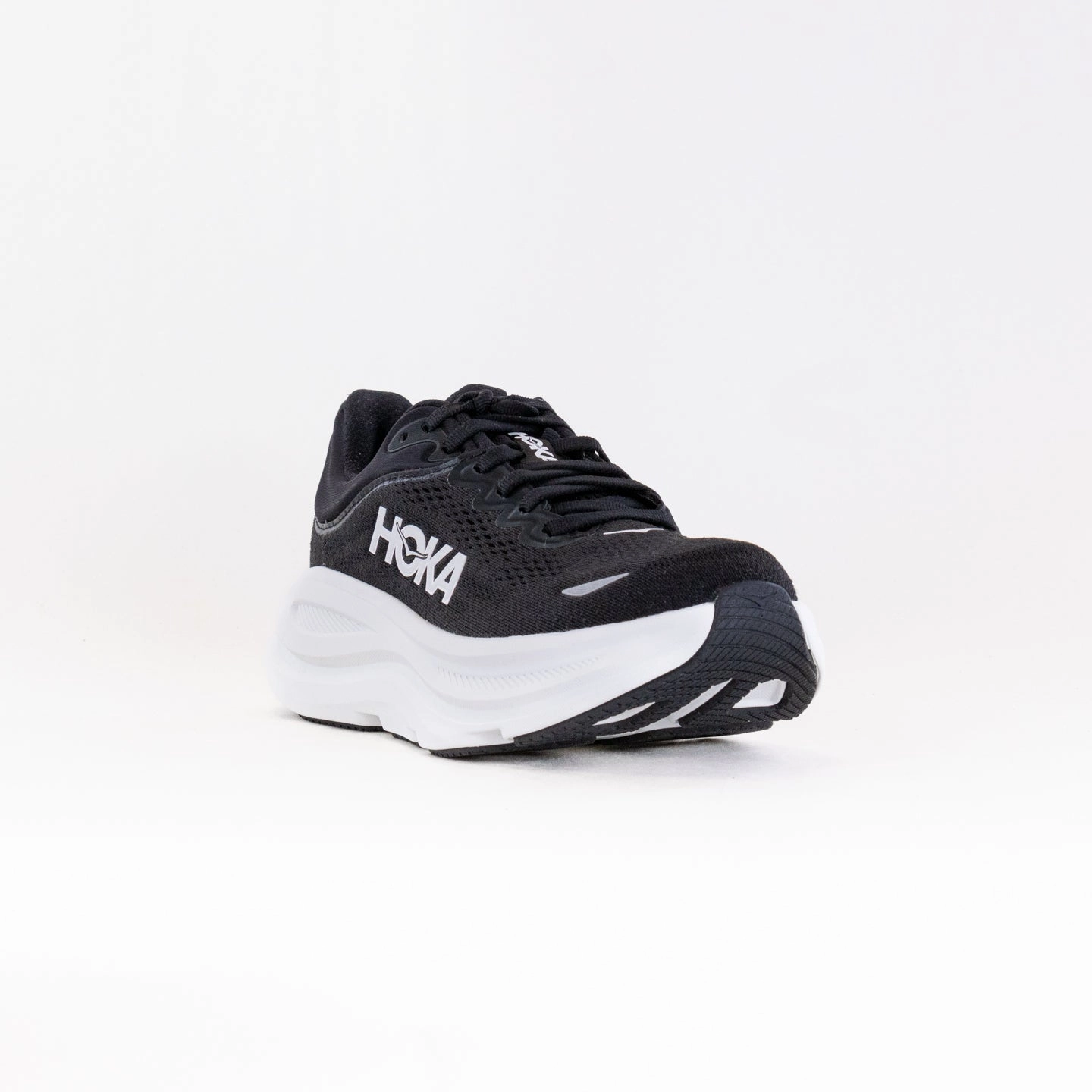 Hoka Bondi 9 (Women's) - Black/White running in a ravine area shoes