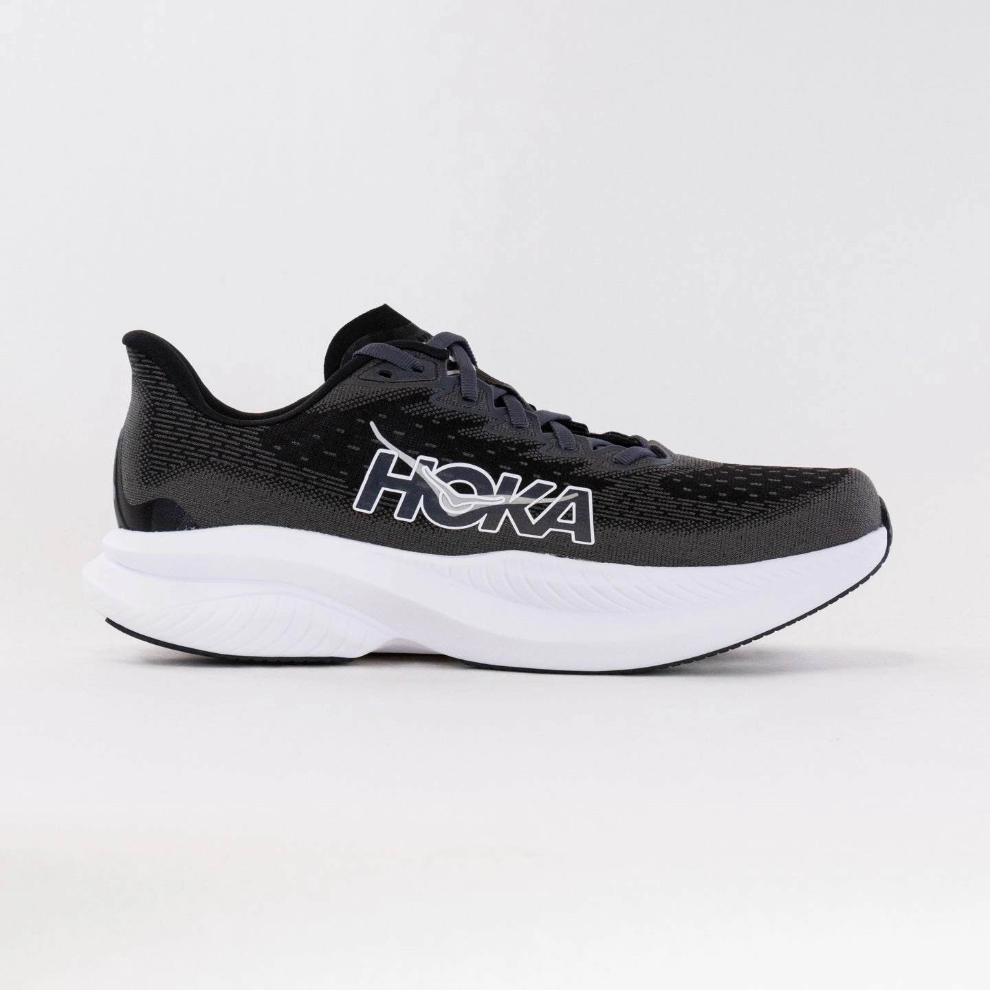 Hoka Mach 6 (Women's) - Black/White running in a glacier area shoes