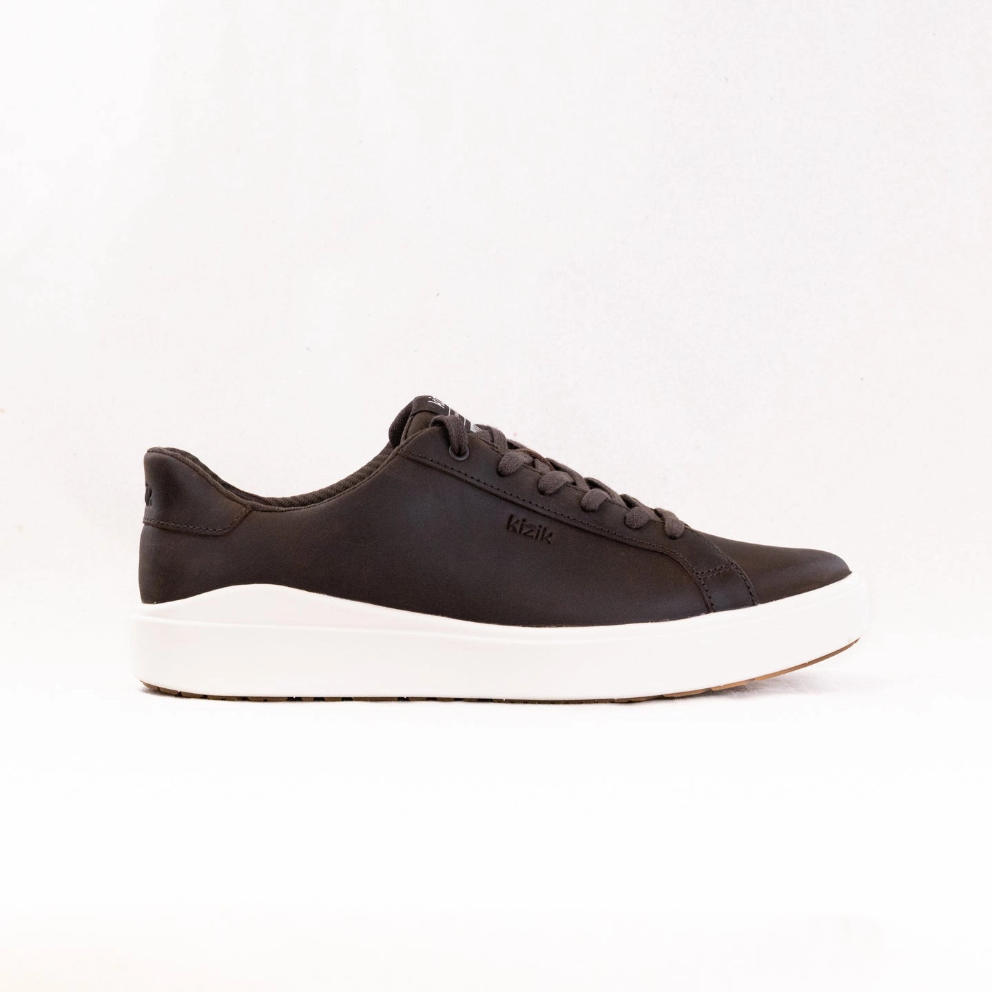 Kizik Vegas 2 (Men's) - Mole/Whitecap Grey running in a cave area shoes arch - hugging shoes