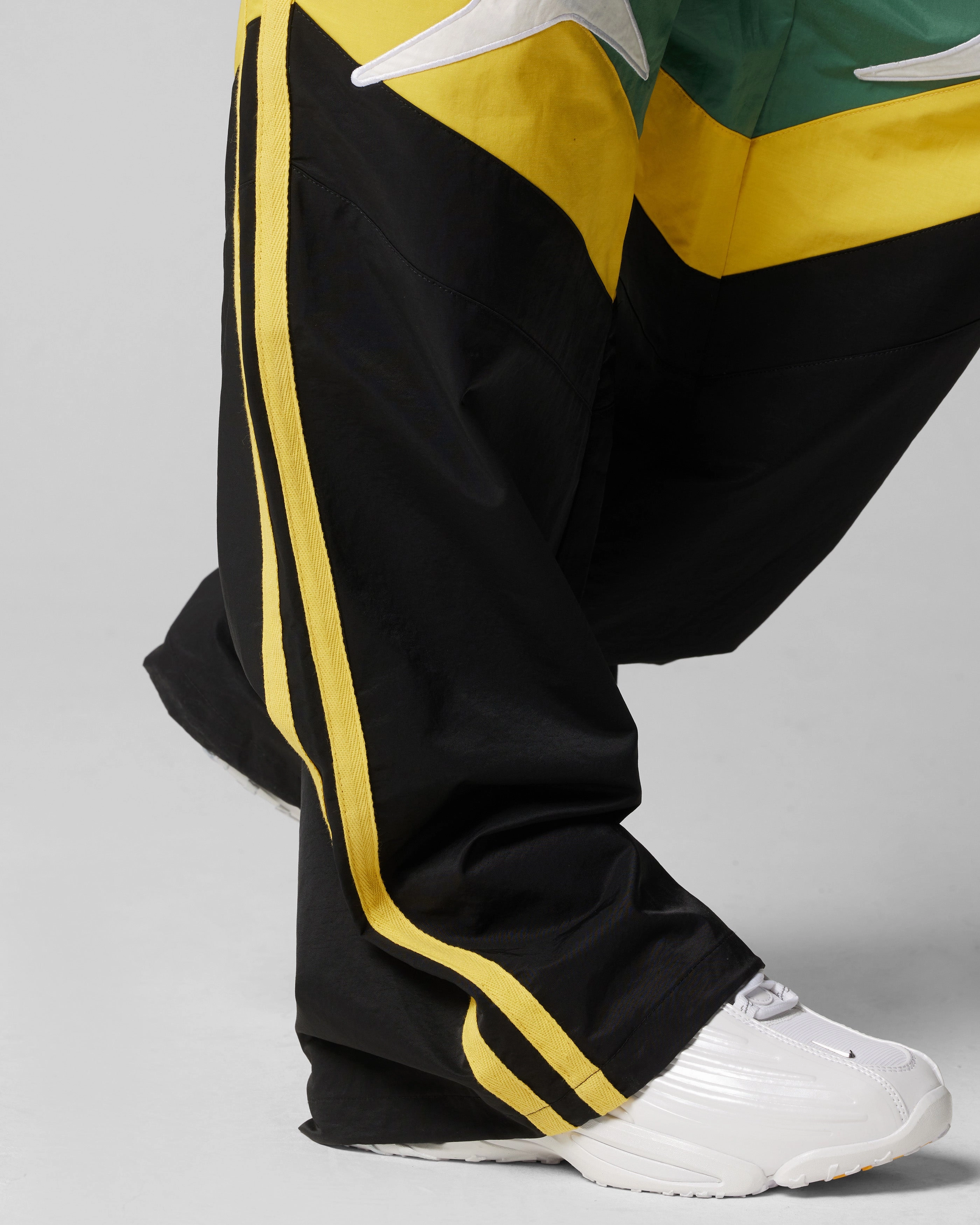 Loiter Hybrid Trackpants Green/Yellow StainResistantCoating DurableReinforcedMaterial