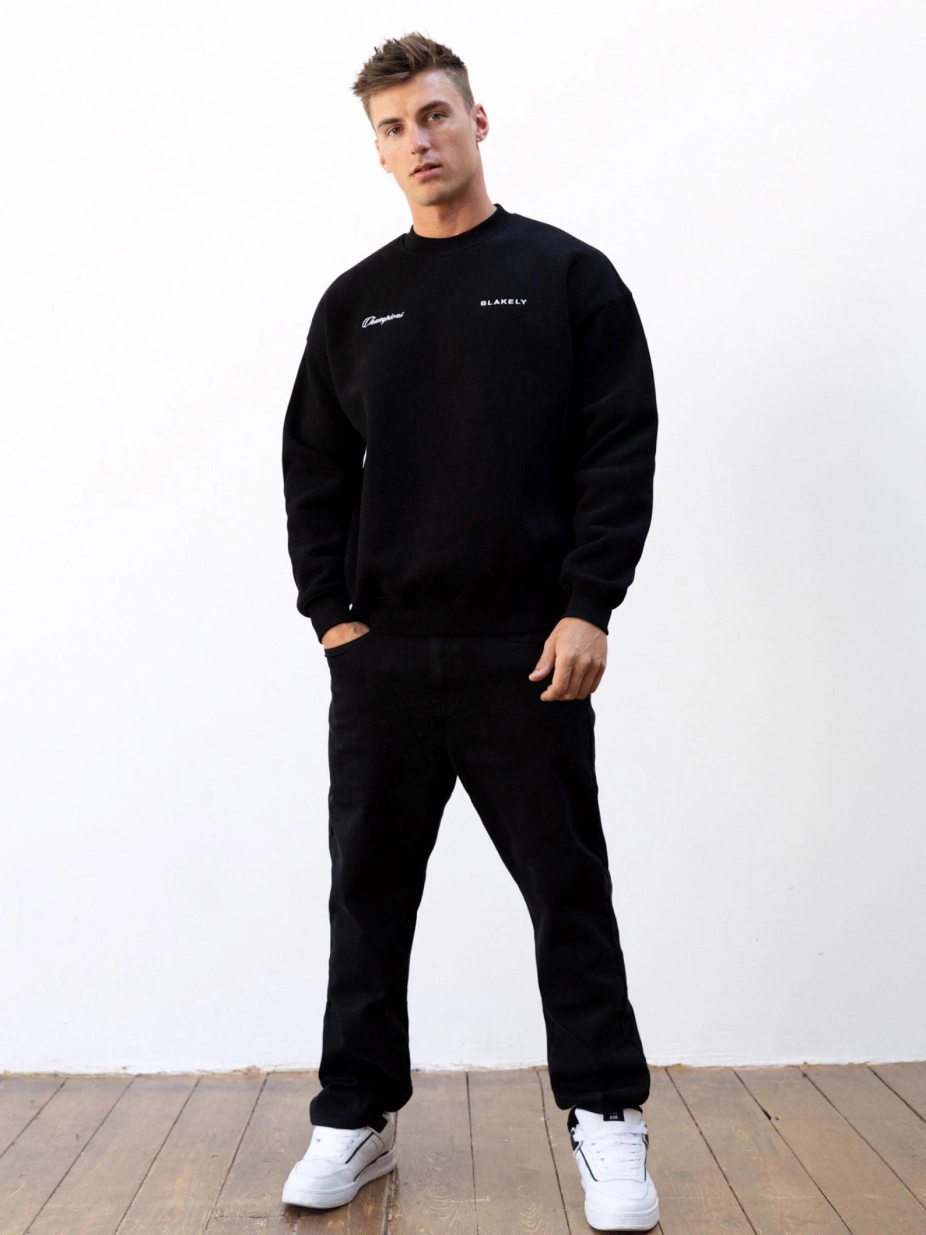 NonRestrictive Cut Champions Legacy Relaxed Sweater - Black