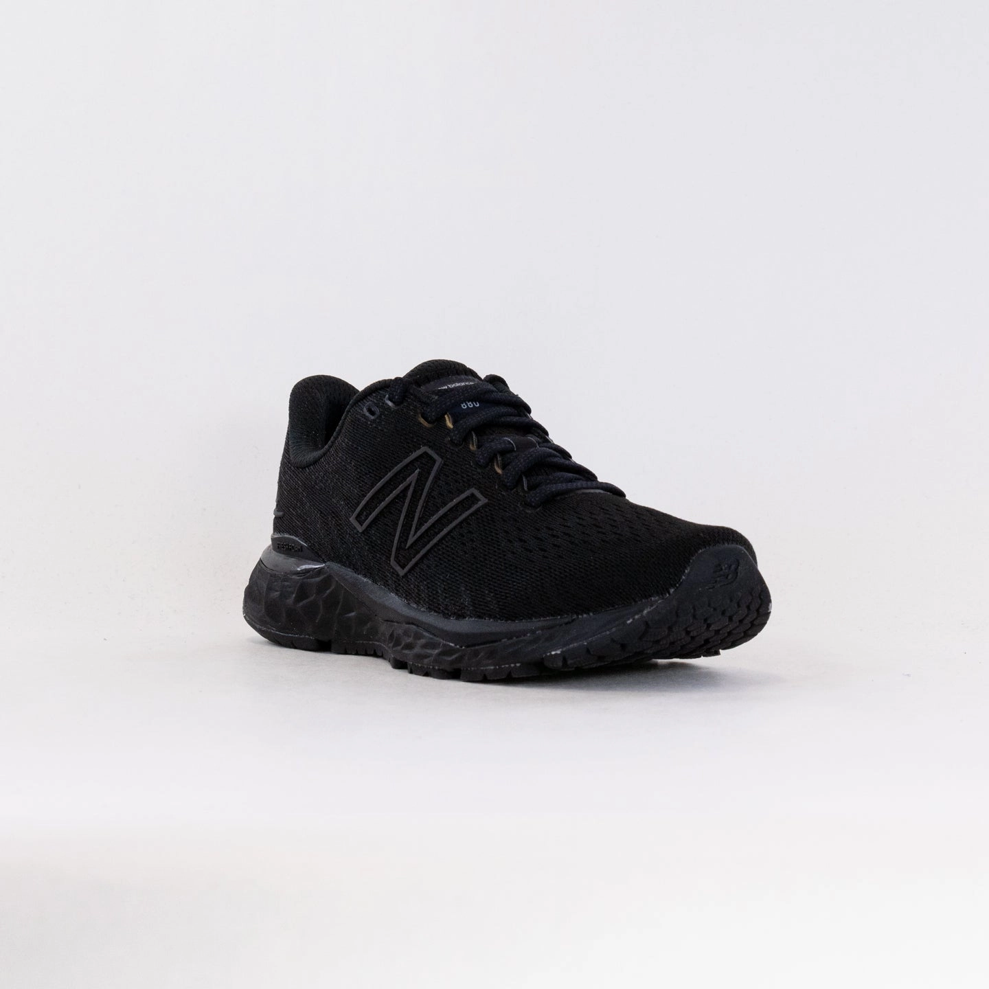 New Balance 880V10 (Men's) - Black/Black running in a lake area shoes