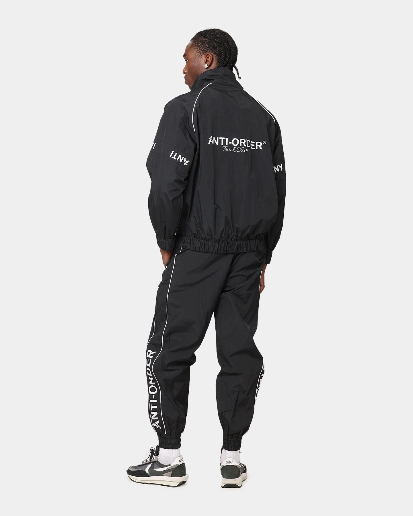 The Anti Order Track Club Windbreaker Jacket Black/Grey Snap Closure System Dual Layer Insulation