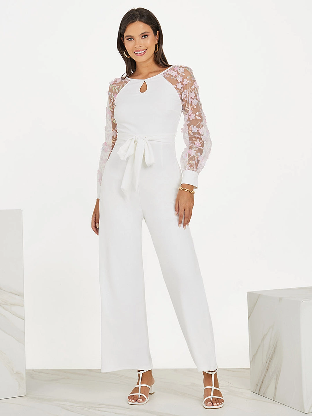 Women's Off White Floral Keyhole Neck Bishop Sleeves Side Pocketed Polyester Back Tie-Up Regular-Length Jumpsuit Bow Glow